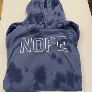 Blue hoodie. Side pockets with a zipper up both sides.